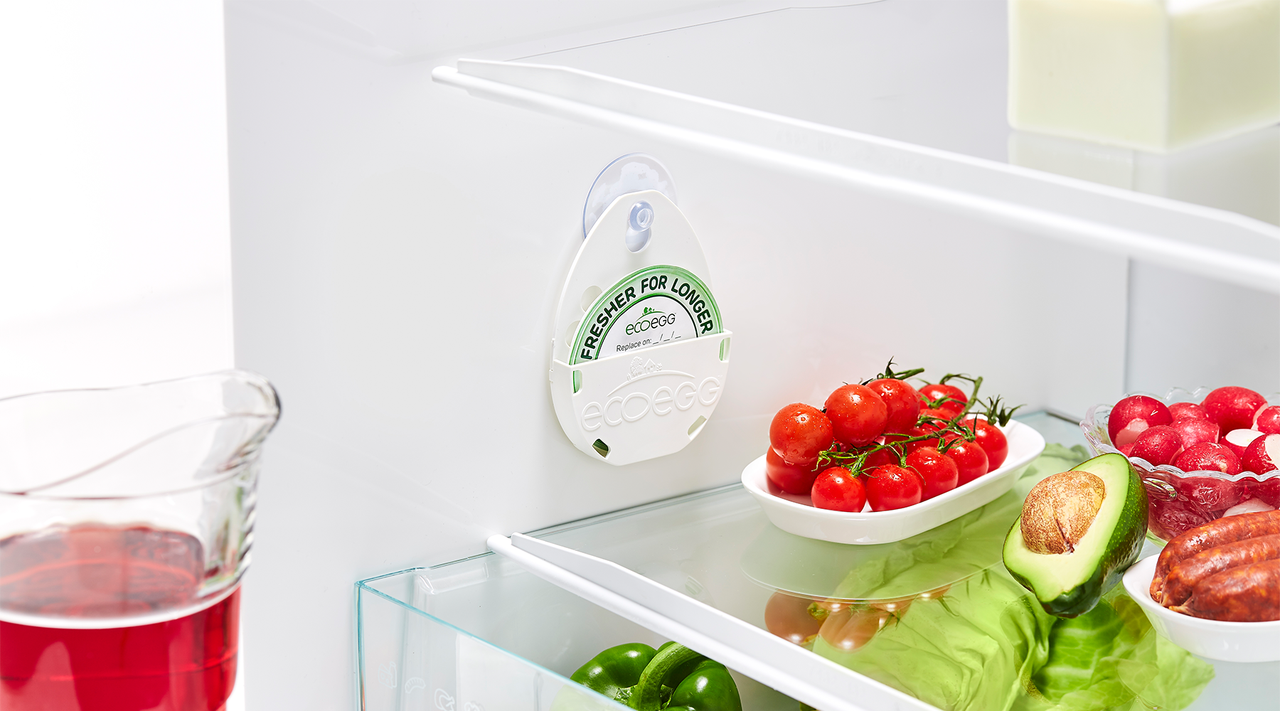Ecoegg Fresher For Longer disc in a fridge with fruit and vegetables