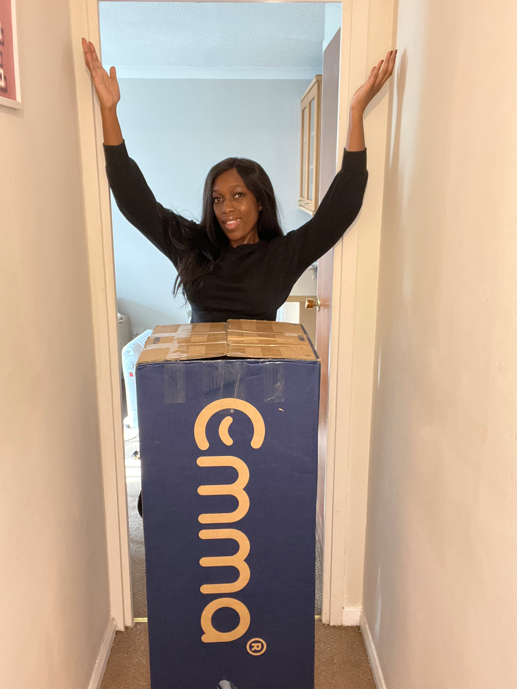 Ophelia in doorway with an Emma mattress box