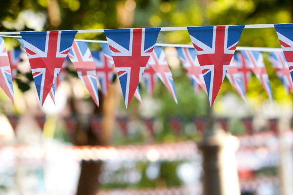 festive garlands of flags with the image of the English flag adorning a festive fairway park